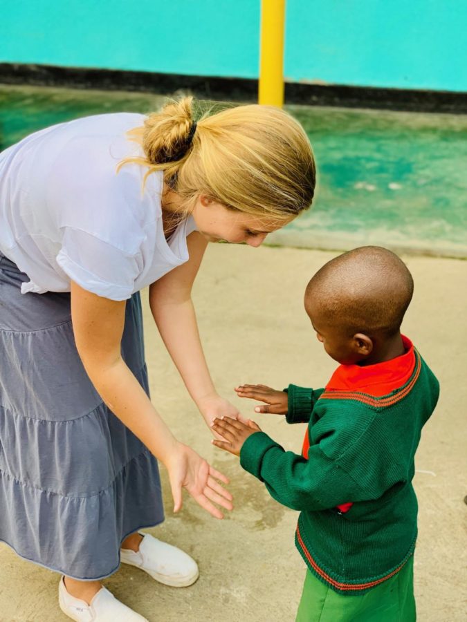 Pictured here is Riley on her mission trip to Africa. She was able to volunteer and spend time with the children.