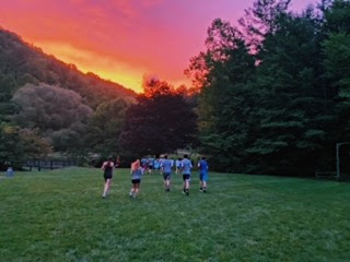 Cross country team practices during beautiful sunrise. The sun peaked through briefly before the rain set in at Windy Gap on Tuesday, August 31. 