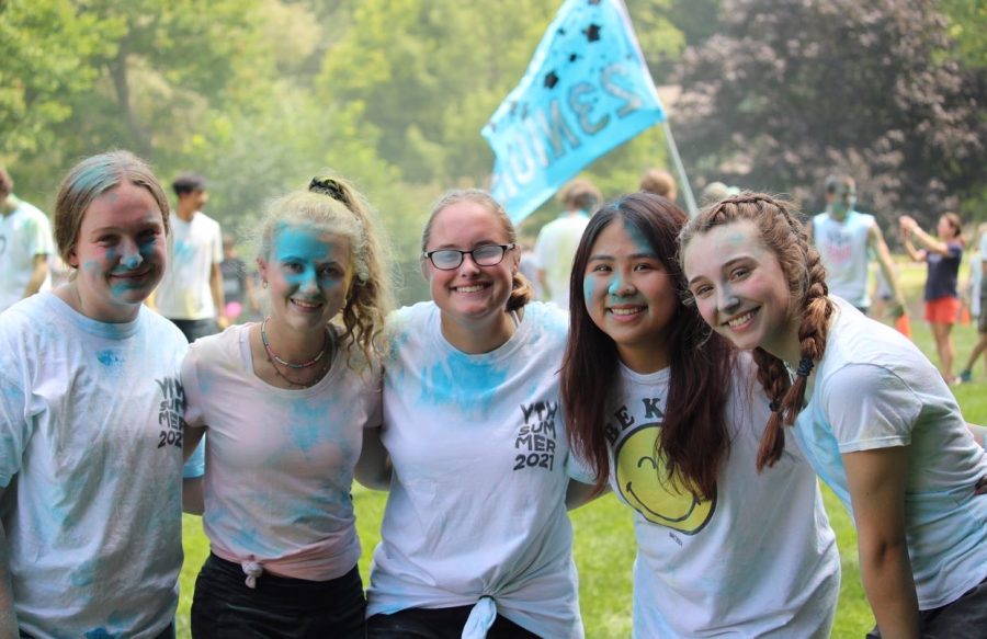 From left, Abby Deitz, Cailey Duguid, Bethany Welch, Linh Bui, and Abby Holshouser pose for a picture after color wars. These girls went in ready for battle at color wars this year.