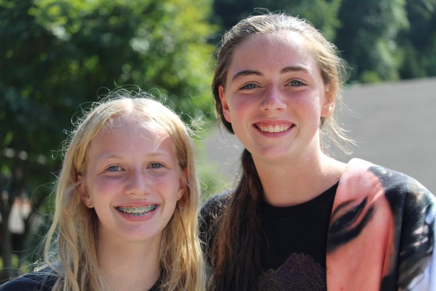 Freshmen students Megan (left) and Lily (right) pose on their way to the pool to have some fun during their free time. The girls had the same big smiles on their face for their first high school Windy Gap.