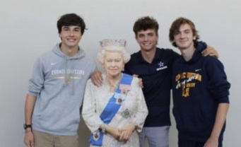 Juniors Thomas Coleman, Cole Bryant, and Ben Freeman pose with the Queen Elizabeth II cutout. The boys paraded around the school with their Queen. 