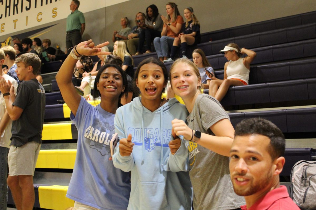 The CCS JV volleyball players get excited after the team scores a point. The girls love to cheer on their friends that play on the varsity team. Featured from left to right: Emma Johnson, Evie McCrory and Piper Bickford.